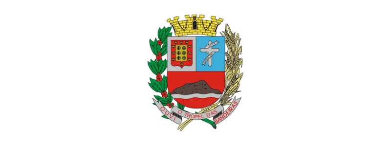 Brasão do município de Atibaia-SP com escudo colorido, coroa dourada no topo e ramos laterais de café e trigo.
