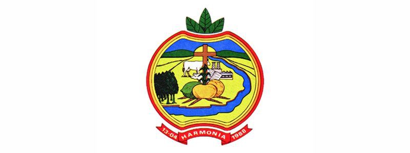 Harmonia/RS abre concurso com salários de até R$ 5.873,26 1 Brasão do município de Harmonia/RS em formato de maçã com elementos agrícolas, cruz ao centro e faixa vermelha com a data 13-04 e o ano 1988.