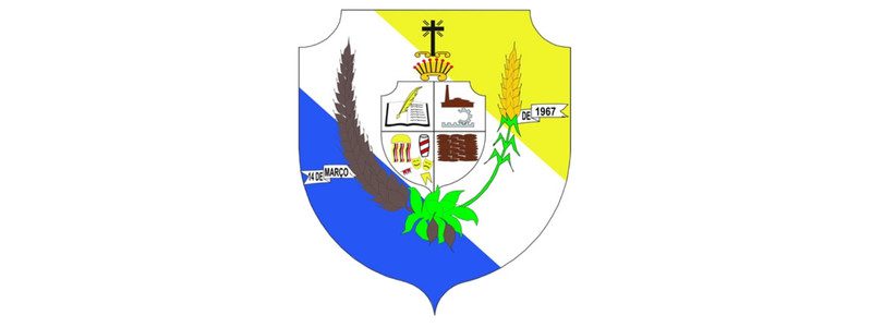 Brasão de Santa Inês-MA com escudo, elementos agrícolas, livro, coroa e faixa com datas e inscrições.
