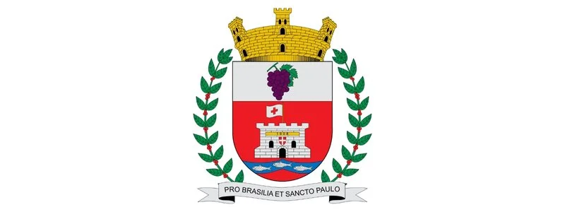 Vinhedo lança concurso c/ vagas imediatas de até R$ 3.114,39 1 Brasão de Vinhedo/SP com escudo dividido em duas partes, cacho de uvas na parte superior e castelo sobre rio na parte inferior, ladeado por ramos verdes e coroa dourada no topo.