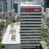 ista aérea do edifício sede do estágio TJMG em Belo Horizonte, com fachada branca e letreiro vermelho