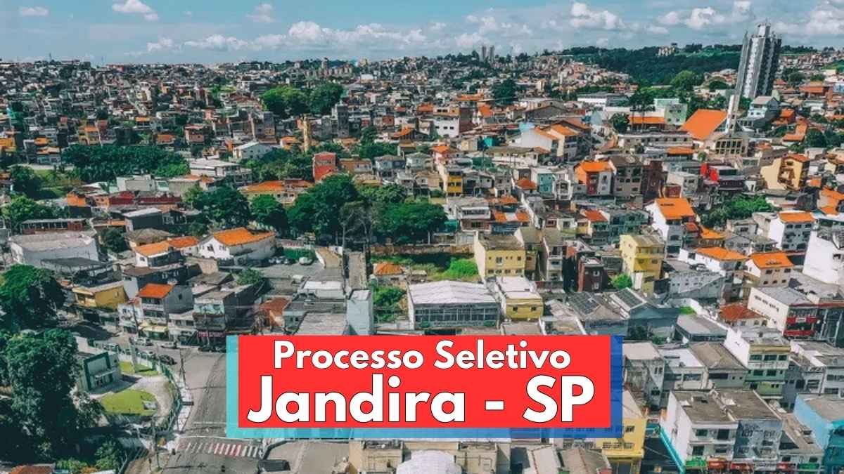 Prefeitura de Jandira SP lança processo seletivo c/ 69 vagas 1 Imagem panorâmica da cidade de Jandira, em São Paulo, com destaque para uma área urbana densamente ocupada, composta por diversas casas e prédios coloridos. A paisagem mostra ruas arborizadas, construções de diferentes tamanhos e estilos, além de um céu azul com nuvens. Na parte inferior da imagem, há uma faixa vermelha com os dizeres “Processo Seletivo Jandira - SP” em destaque.